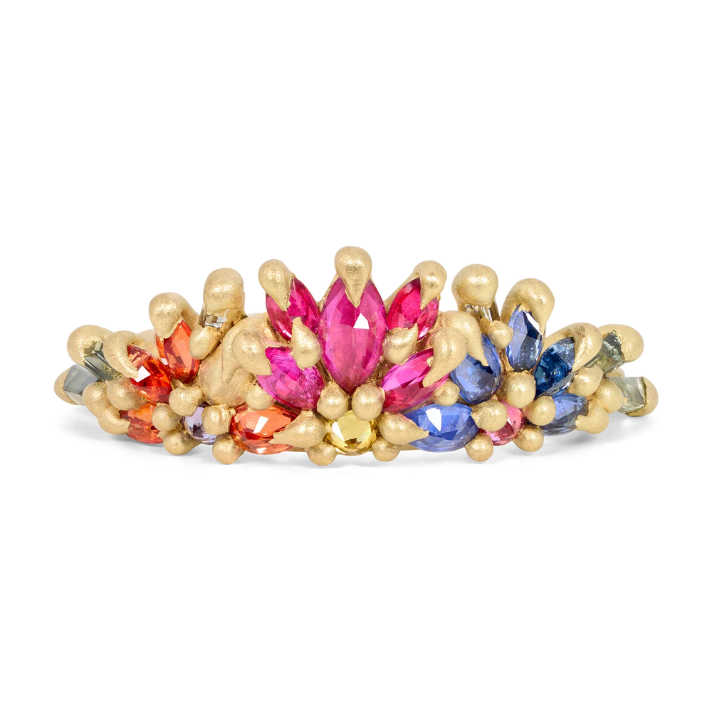 Studio shot of Rainbow Daisy Garland Ring by Polly Wales. 