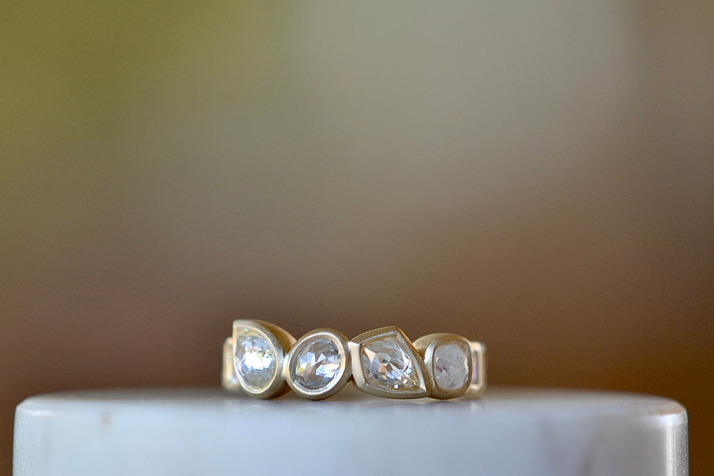 Diamond Medley Band by Elizabeth Street Jewelry is a Mixed cut and bezel set radiant cut diamonds 2.18TCW with white baguette accented shank on a 14k yellow gold band with satin finish. Handmade in Los Angeles.