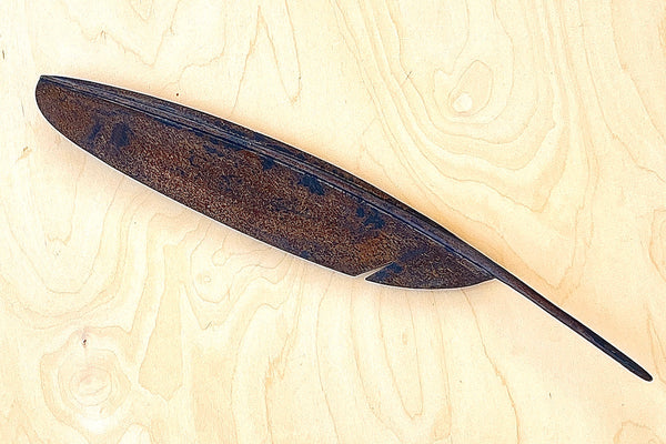 A sculpture of a feather to double as a fountain pen rest 3650 in patina.  Designed by Carl Auböck and handmade in Austria. Founded in 1906, the workshop is still owned and operated by the Auböck family. fountain pen rest.