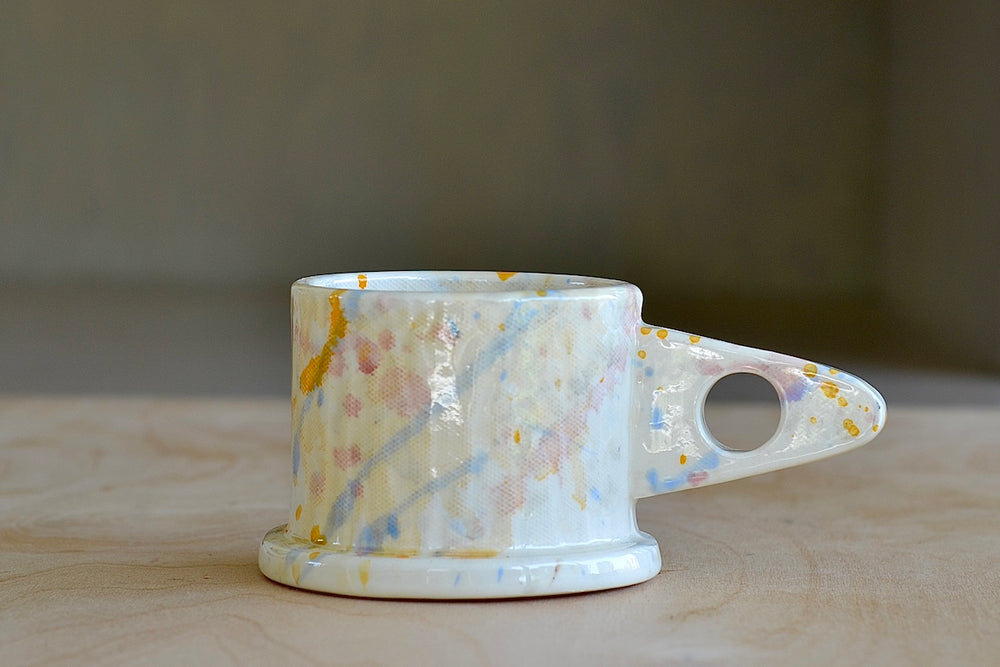 EXP standard splatter mug in yellow drip by Peter Shire and Echo Park pottery . 