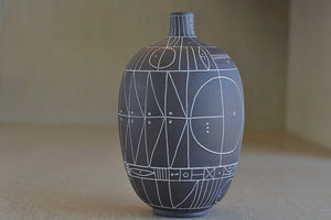 Hand thrown dark brown clay vase with white  sgraffito "Scribe series" by Heather Rosenman.