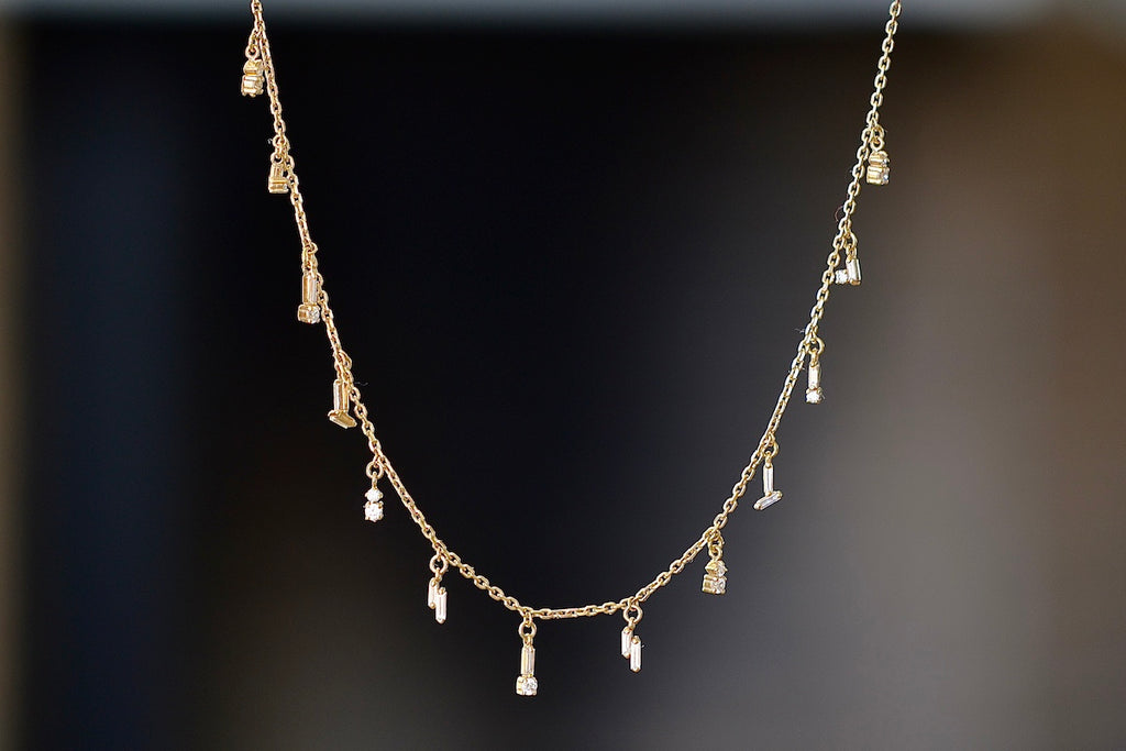 Mini Diamond  Dangle Necklace by Suzanne Kalan is an 18k gold chain necklace with mixed drop dangles in white diamond baguettes and round diamonds.