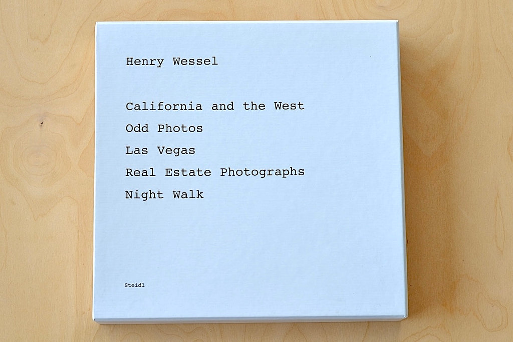 V Book Henry Wessel Steidl Five Books Slipcase From renowned photographer Henry Wessel come five photo stories on the landscape of Southern California and the American West taken between the 1970s and the early 2000s. California and the West, Odd Photos, Las Vegas, Real Estate Photographs and Night Walk are slipcased in this first collaboration with Steidl. A mint and out of print five book set in slipcase are available.
