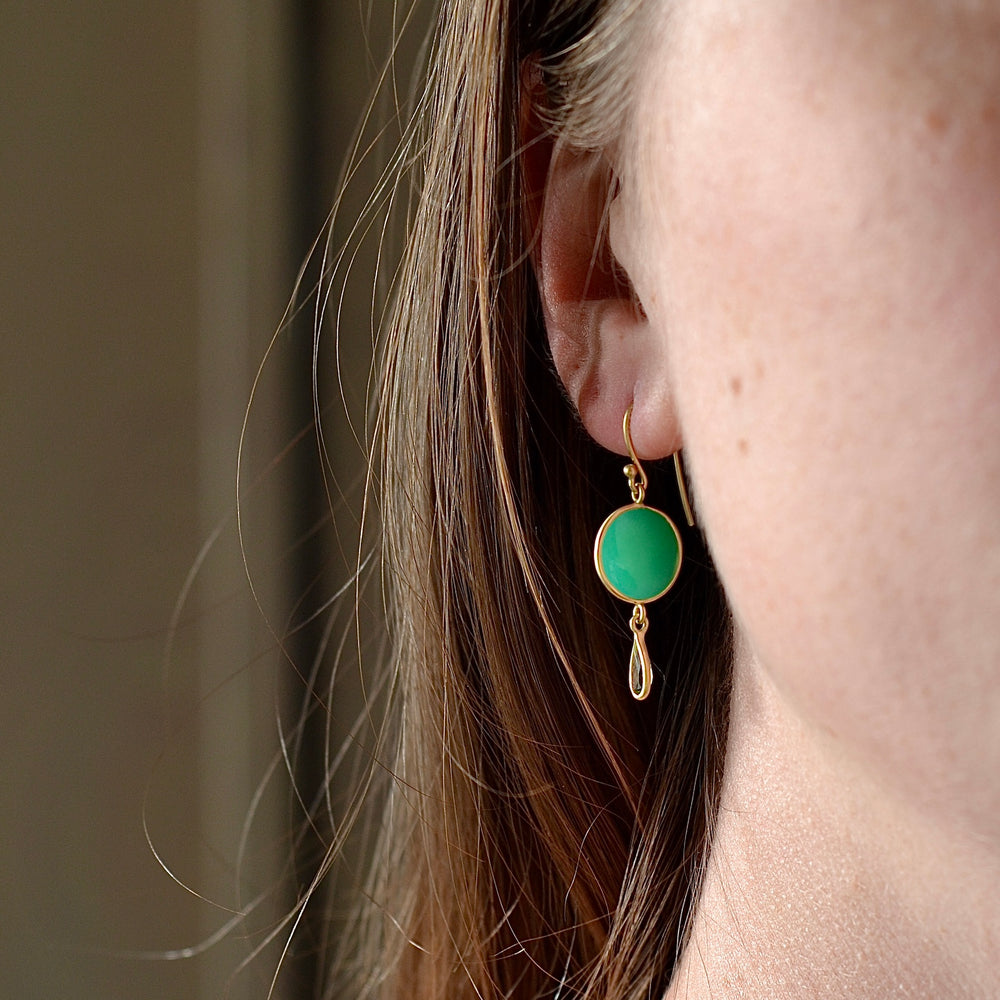 Showing the Moon and drop earrings worn.