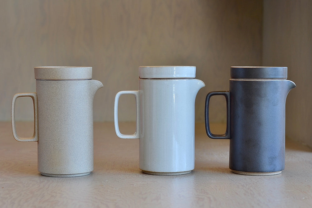 Side view of all three color ways of the tall Hasami teapot, showing Natural, gray and black.