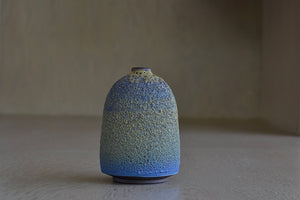 Heather Rosenman Short Blue with Yellow Volcanic Vase is a hand thrown one of a kind piece.