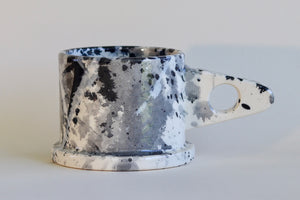 Gray and black EXP splatter mug available at OK.