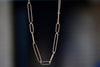 Long 14k gold paperclip chain with two short, one long flat clips in 17 inches by Kaylin Hertel.