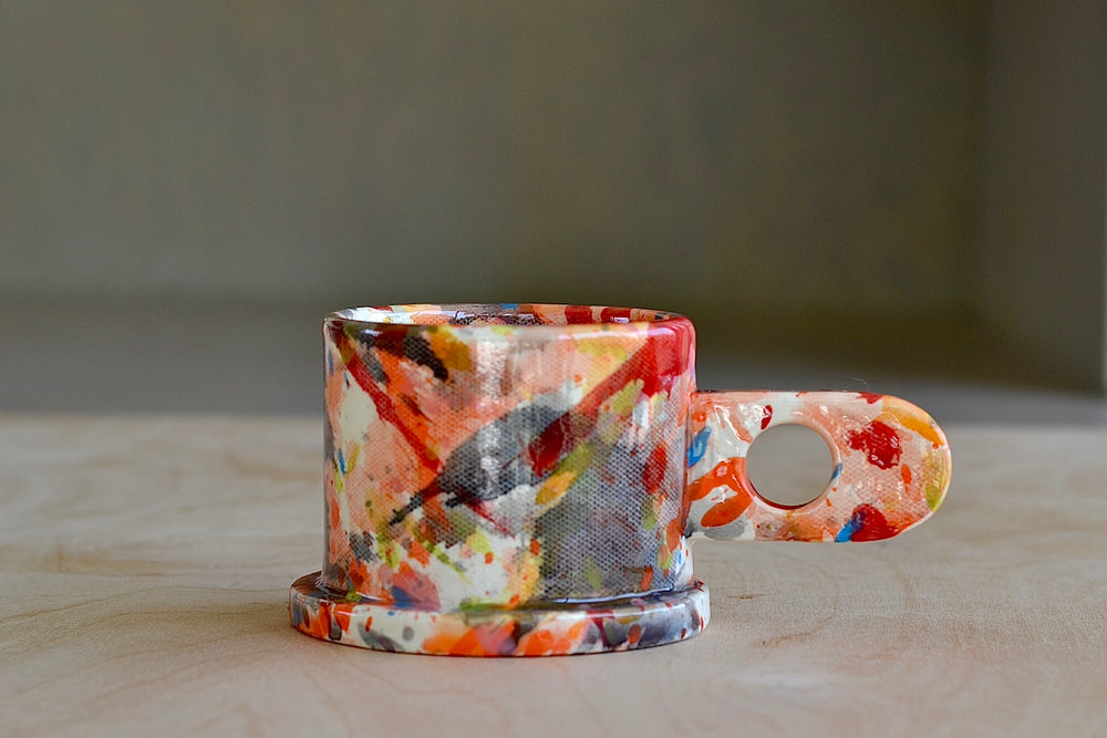 EXP standard splatter mug in red, orange, gray and blue by Peter Shire nd Echo Park Pottery.