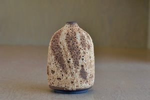 Striped cream to brown bottle  ceramic vase by Heather Rosenman.