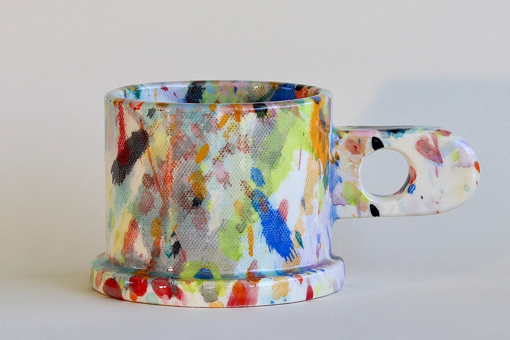 Acid green, Blue, yellow, red and black EXP splatter mug available at OK.