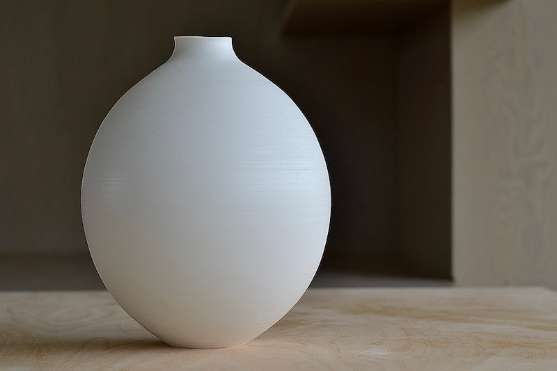 Lilith Rockett Large Round Vase is wheel thrown porcelain with gloss glaze on the interior and an unglazed exterior.