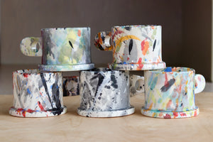 A selection of EXP standard splatter mugs by Peter Shire and Echo Park Pottery.