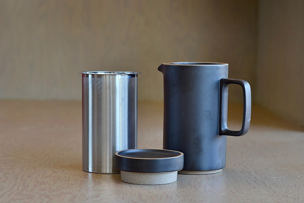 Showing the tall Hasami Teapot with separate parts including stainless steel infuser strainer and lid.
