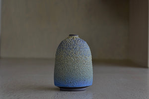 Alternate side of Heather Rosenman Short Blue with Yellow Volcanic Vase.