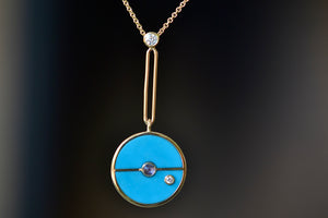 Close up of Compass Pendant in Turquoise and Tanzanite by Retrouvai.