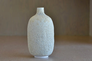 Other side of Hand thrown oval Vase in Cream to white Volcanic Glaze by Heather Rosenman.