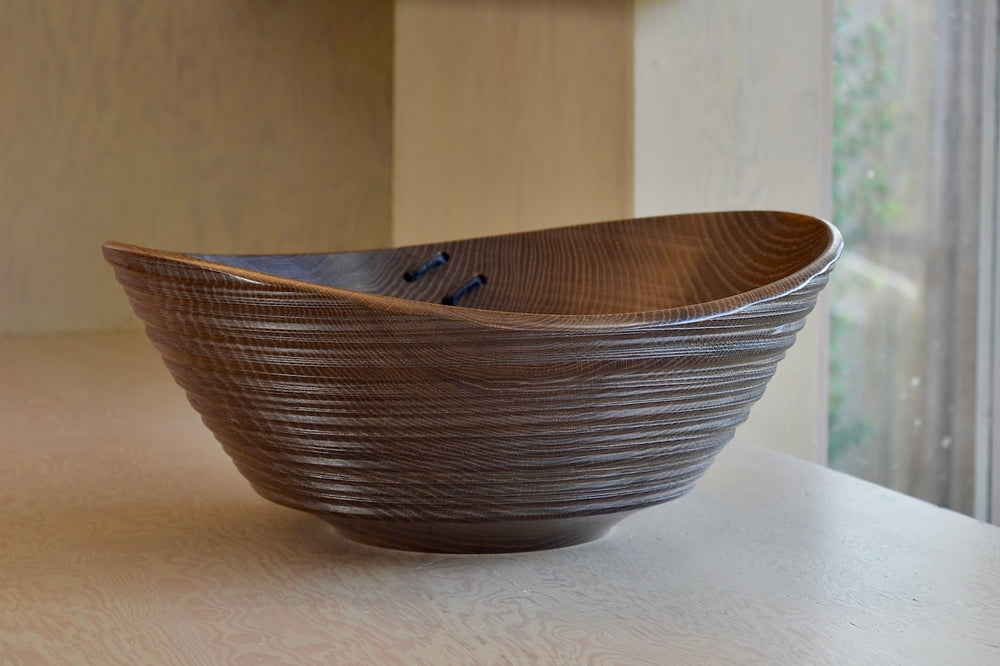 Circle Factory Bowl in Brown Oak With Ridges and Repair Detail.