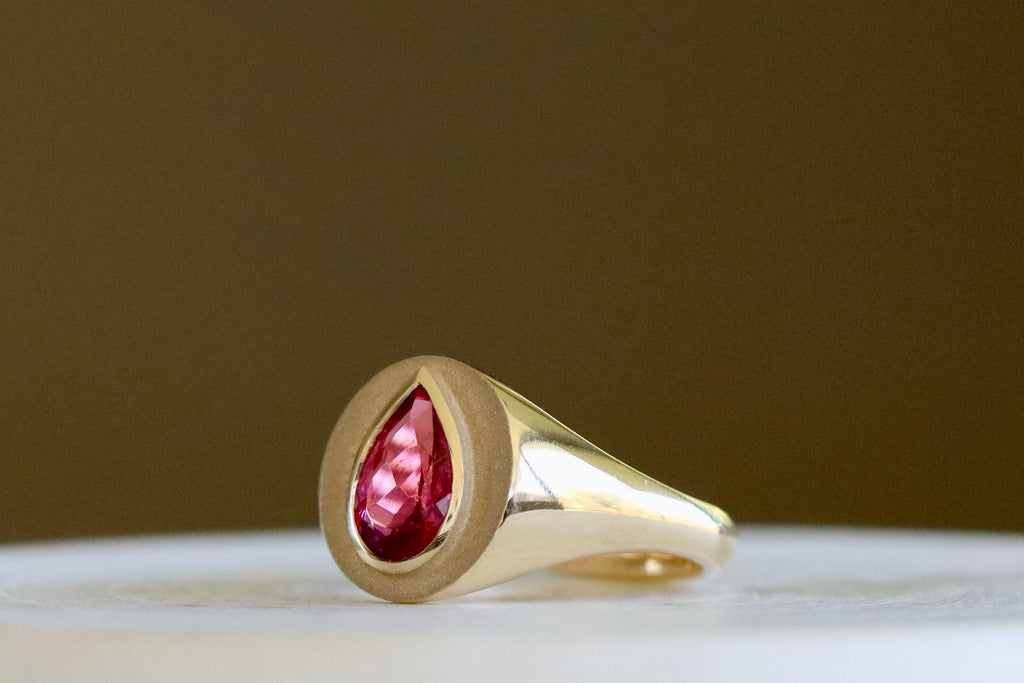 Side view of Circle Signet with Pear Tourmaline by Elizabeth Street Jewelry.