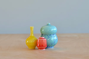 Miniature Hand Thrown Ceramic Vase Trio "F" in Yellow, Coral and Spotted Turquoise / Blue by Yuta Segawa on white.