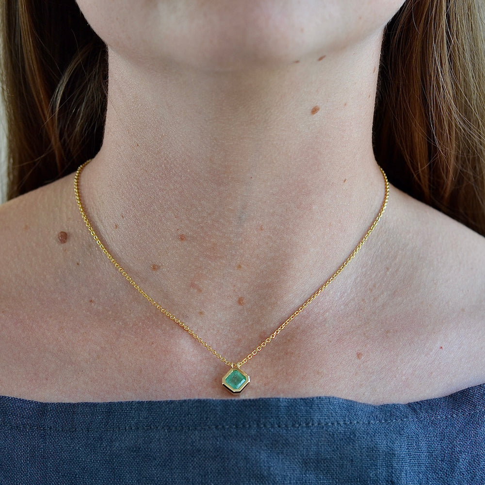 Wearing the Duo Bale Offset Emerald Necklace.