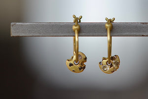 One more of Polly Wales spinner hinge hoop earrings with diamonds and sapphires.