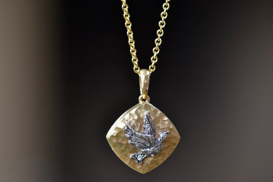 Close up of The Bird Sliding Locket by Arman Sarkisyan.