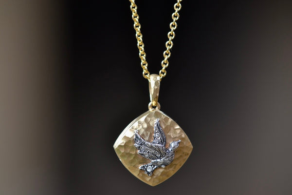 Close up of The Bird Sliding Locket by Arman Sarkisyan.