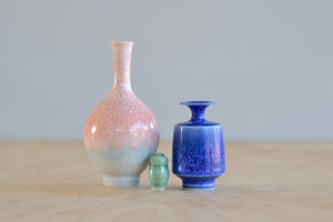 Miniature Hand Thrown Ceramic Vase Trio by Yuta Segawa  in Blue, Green celadon and Pink with Light Blue on white background.