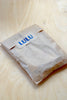 Assorted Dosa Napkins in a set of four(4) in paper bag with Lulu sticker.