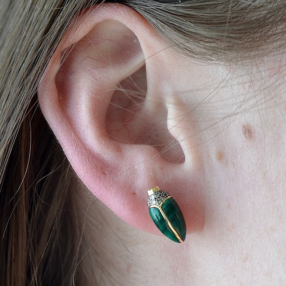 Wearing the Scarab stud earring by Bibi Van Der Velden in malachite.