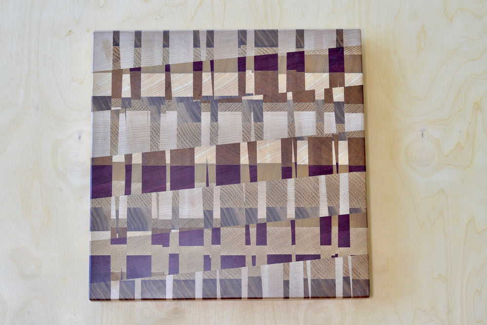 Medium cutting board with cherry and mised wood blocks designed by Chris Karlson.