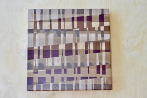 Medium cutting board with cherry and mised wood blocks designed by Chris Karlson.