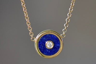 Retrouvai Mini compass pendant in lapis with a center diamond.