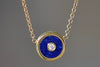 Retrouvai Mini compass pendant in lapis with a center diamond.