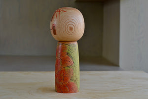 Side view of Kokeshi doll.