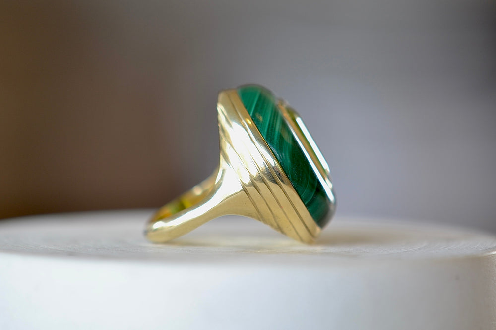 Side view of the The Large Lollipop Ring in malachite and Green tourmaline by Retrouvai. 