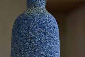 Close up detail of Heather Rosenman Tall Blue with Yellow Volcanic Vase.