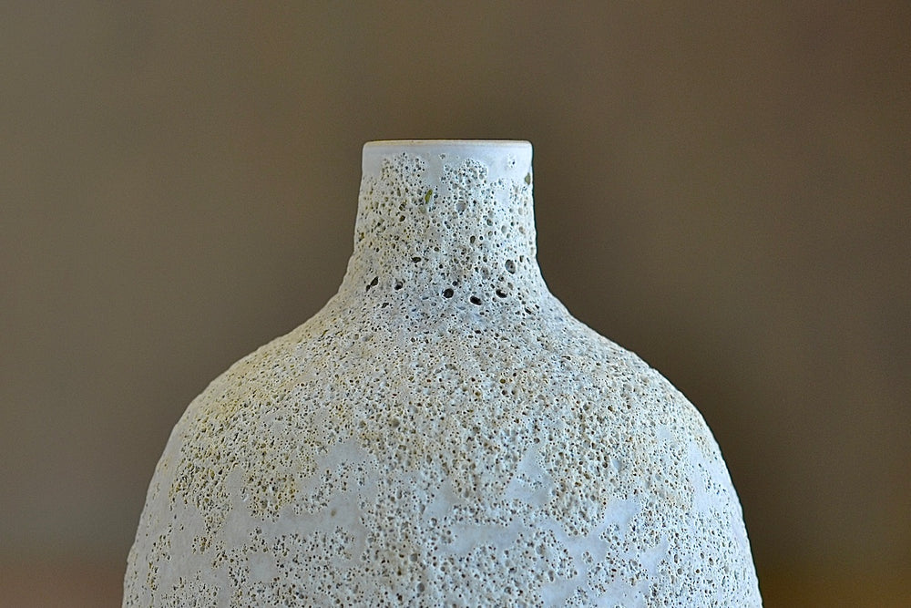 Detail of Heather Rosenman volcanic vase in cream.