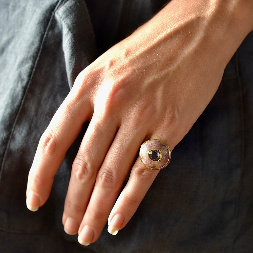 Wearing the small petite lollipop ring  in trolleite and spinel by Retrouvai.