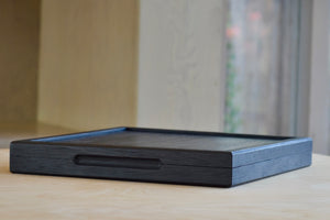 Showing black box closed with spoons inside.