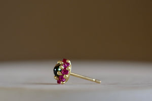 Side view of the green and pink Larkspur stud by Polly Wales.