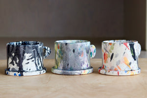 A selection of EXP standard splatter mugs by Peter Shire and Echo Park Pottery.