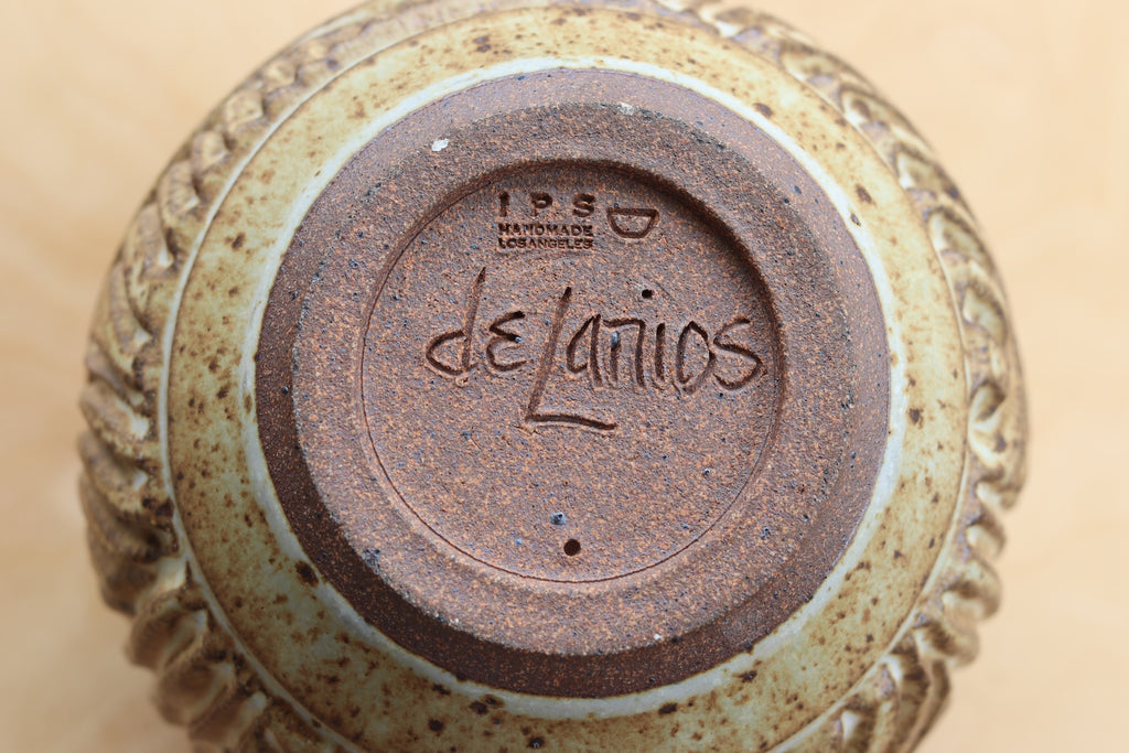 Dora de Larios signature on brown ceramic IPS Irving Place Studio vase.