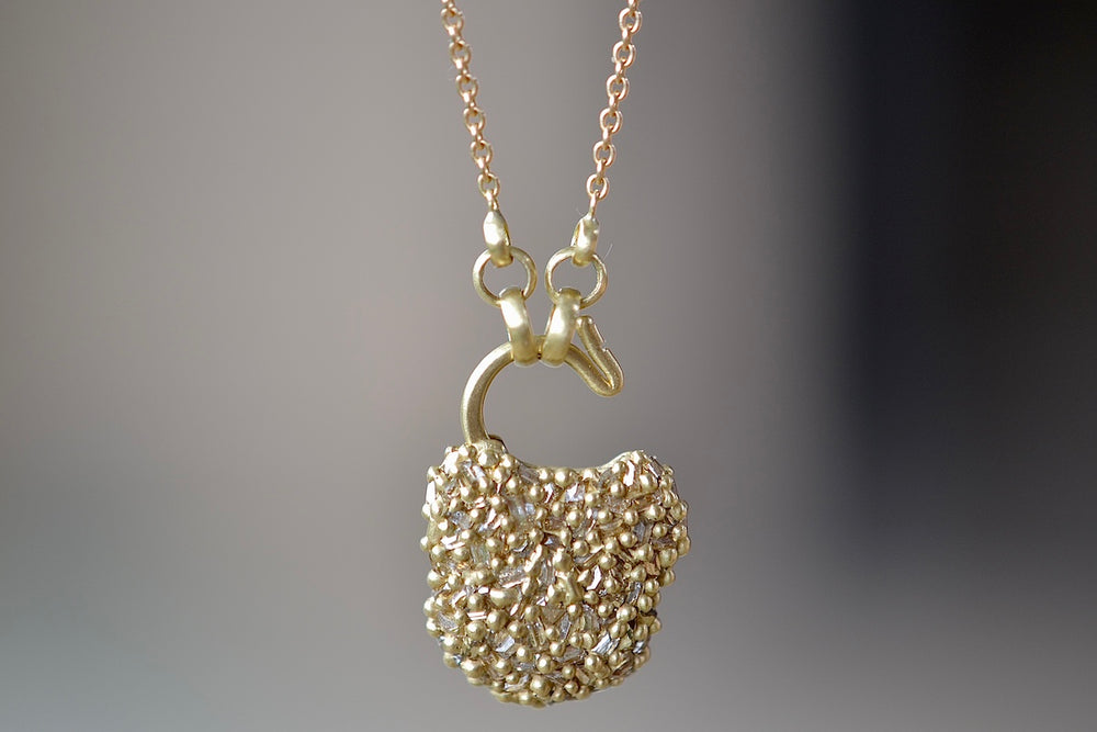 Showing the Small River Diamond Baguette Fuzzy Pad Lock Necklace "Petite Coeur de Fantasie"  open. Designed by Polly Wales. Cast Not set.
