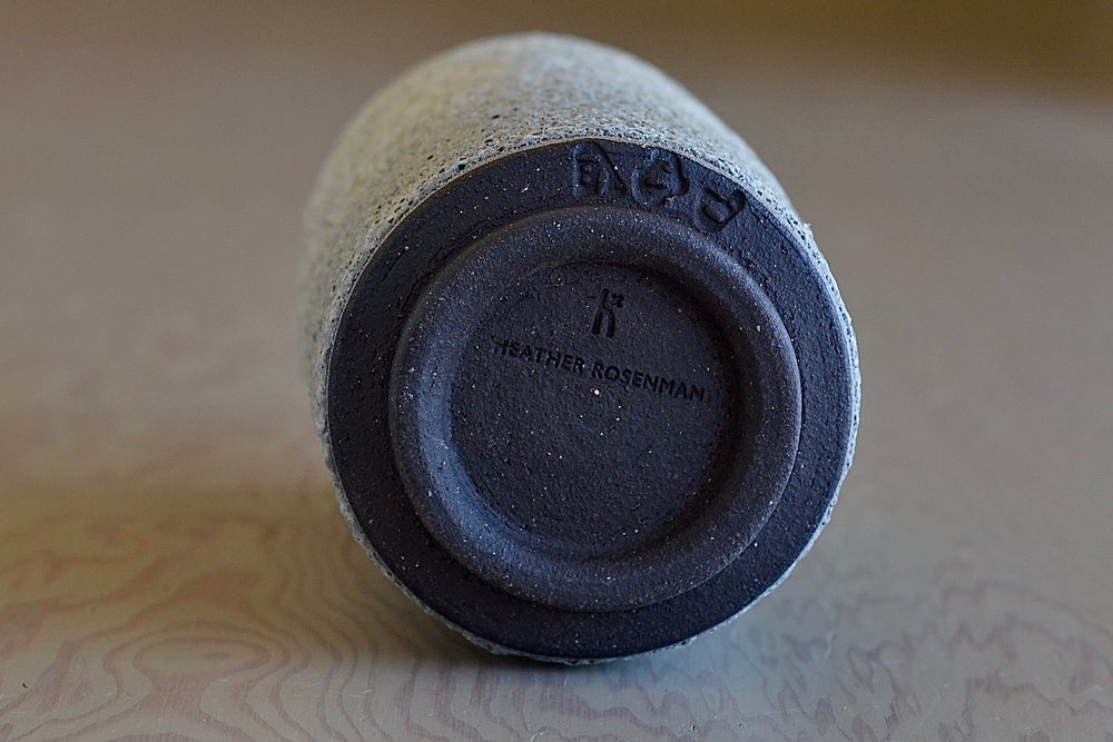 Stamp on Gray to white Cyliner ceramic vase by Heather Rosenman.