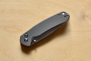 Pyrite Button Lock Titanium Knife folded,showing button side.