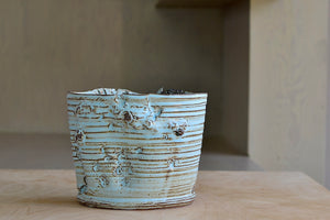 Other side of Hyejeong Kim Torn Vase #16 in blue celadon.