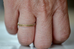 Wearing the Black Diamond Stackable Eternity Band by Lizzie Mandler.