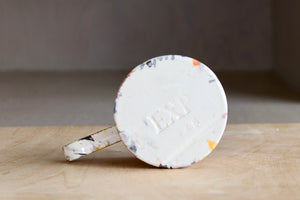 Bottom of EXP splatter mug.